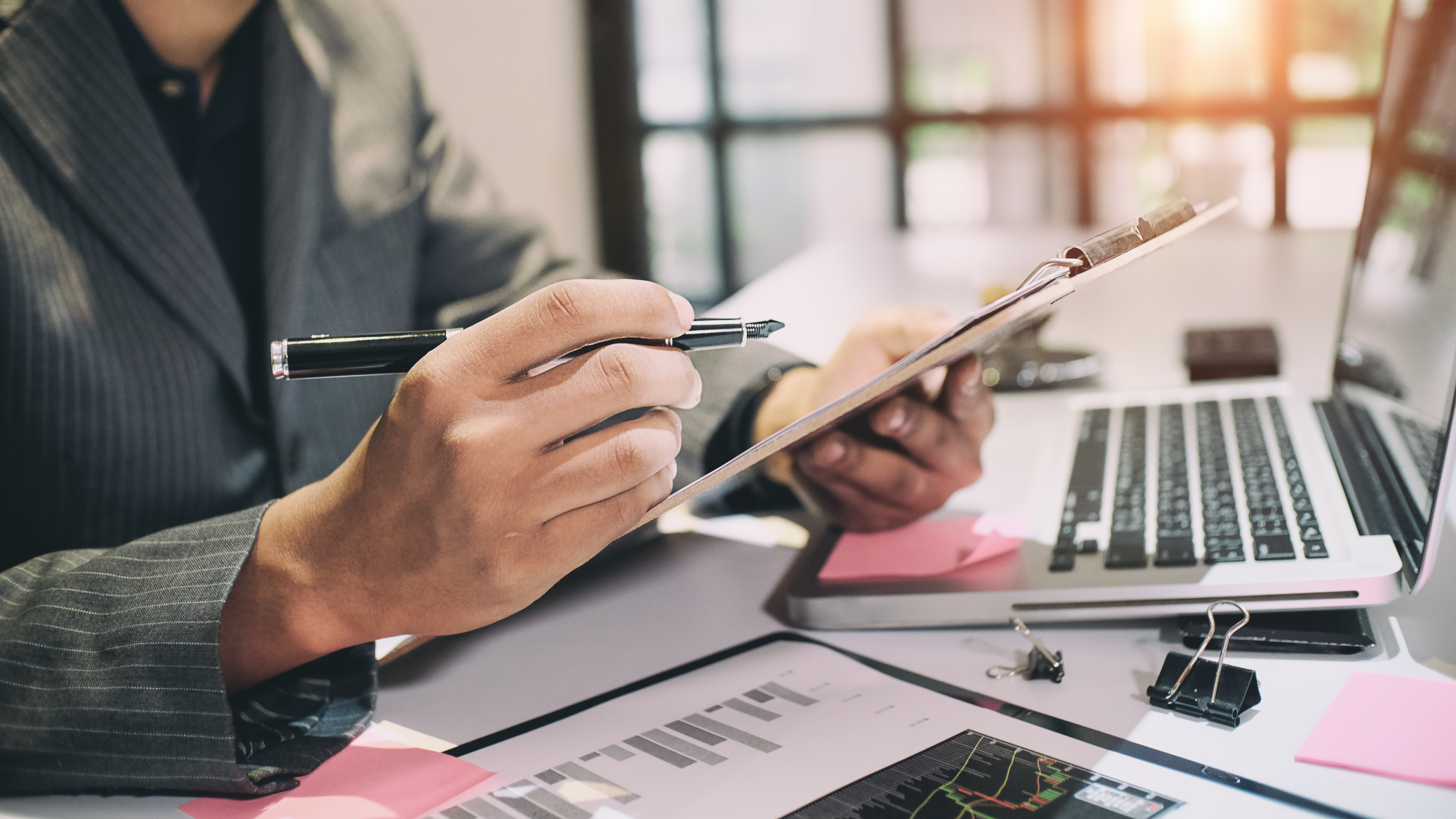 Common Tax Breaks for Homeowners Audit concept,Bookkeeper or financial inspector and secretary making report Financial Planning Report in Spreadsheet .Internal revenue Service inspector checking financial document vintage tone.